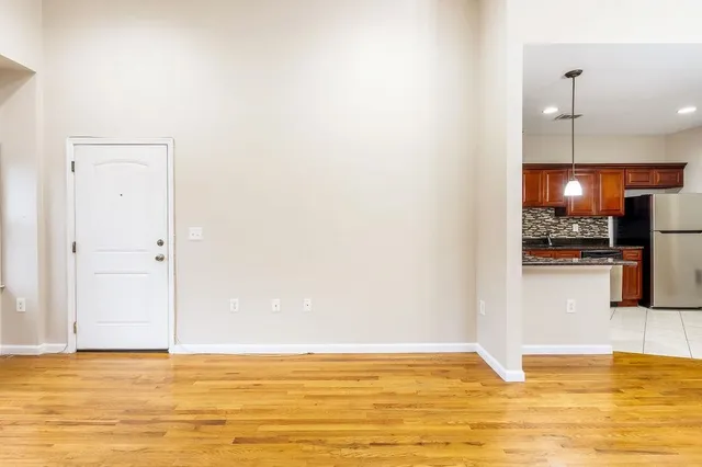 a kitchen with stainless steel appliances granite countertop a stove sink and cabinets
