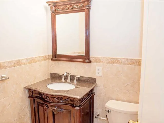 a view of a bathroom from a hallway