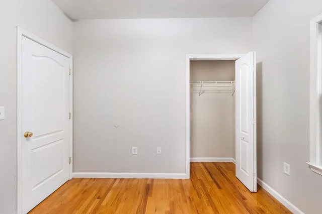 a view of a patio with a table and chairs