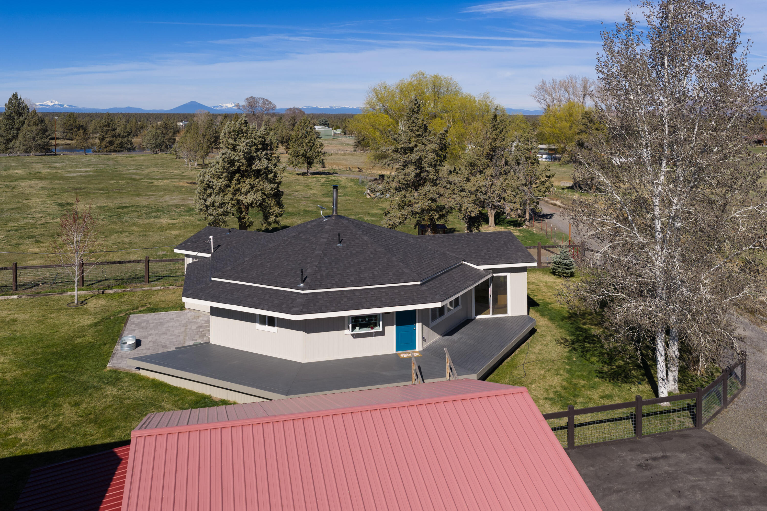 4074 Southwest Reif Road Powell Butte, OR 97753 - Photo 47 of 59 a view of a house with a yard
