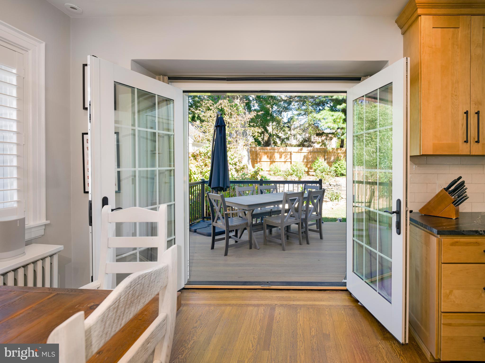 11 Shirley Road Narberth, PA 19072 - Photo 20 of 44 a view of a dining room with furniture a chandelier and wooden floor