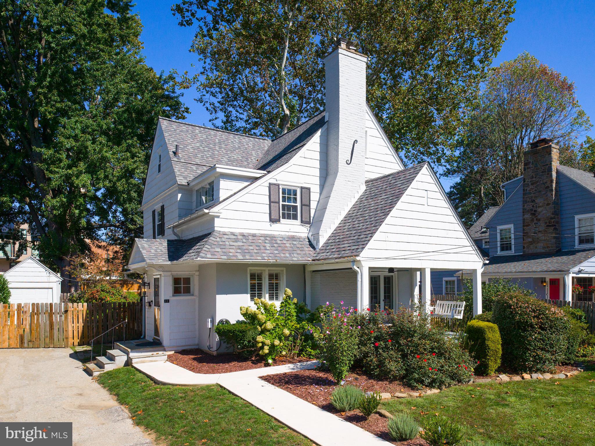 11 Shirley Road Narberth, PA 19072 - Photo 2 of 44 a front view of a house with a yard and potted plants