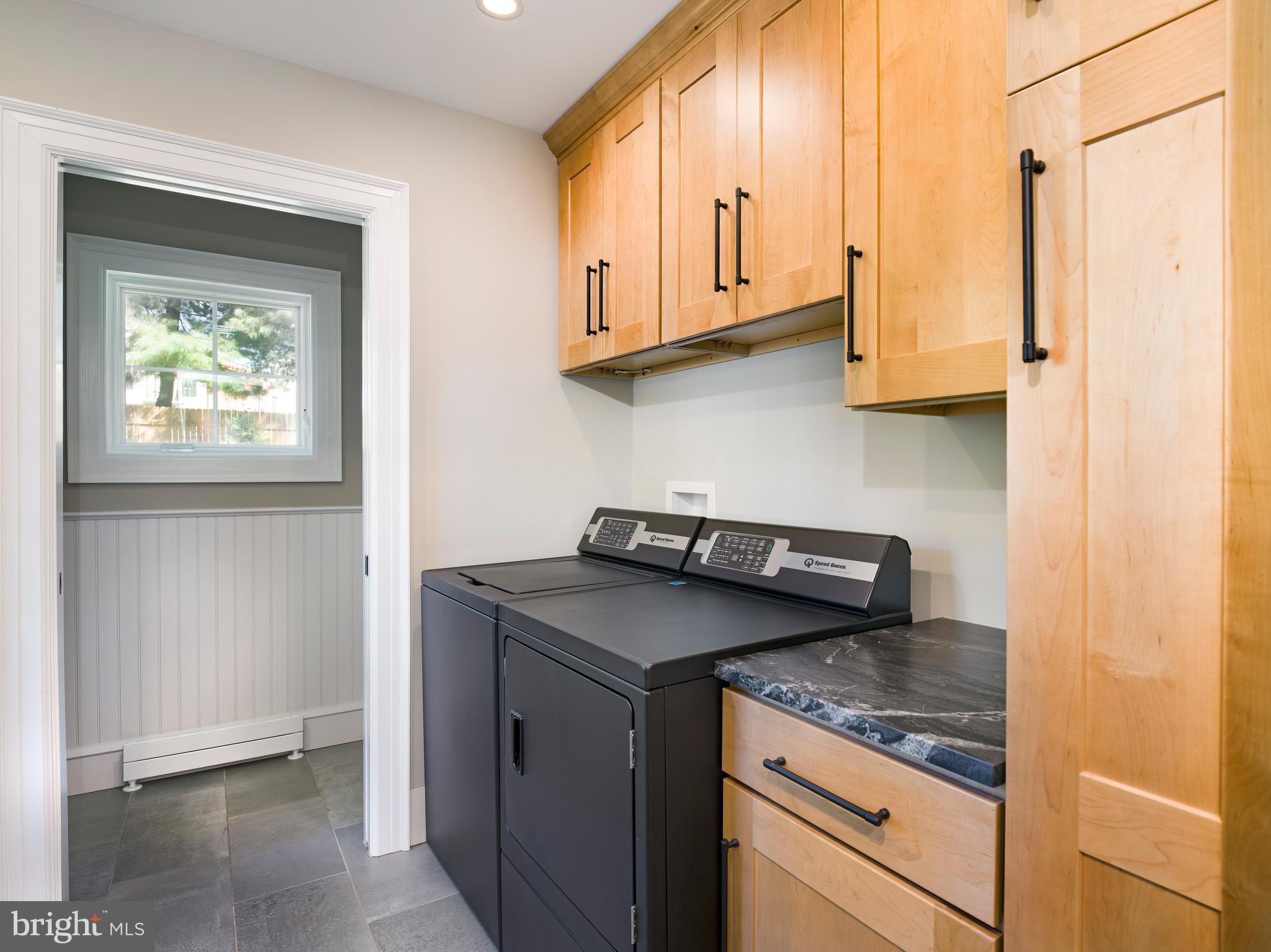 11 Shirley Road Narberth, PA 19072 - Photo 22 of 44 a kitchen with stainless steel appliances granite countertop a sink a stove and a microwave