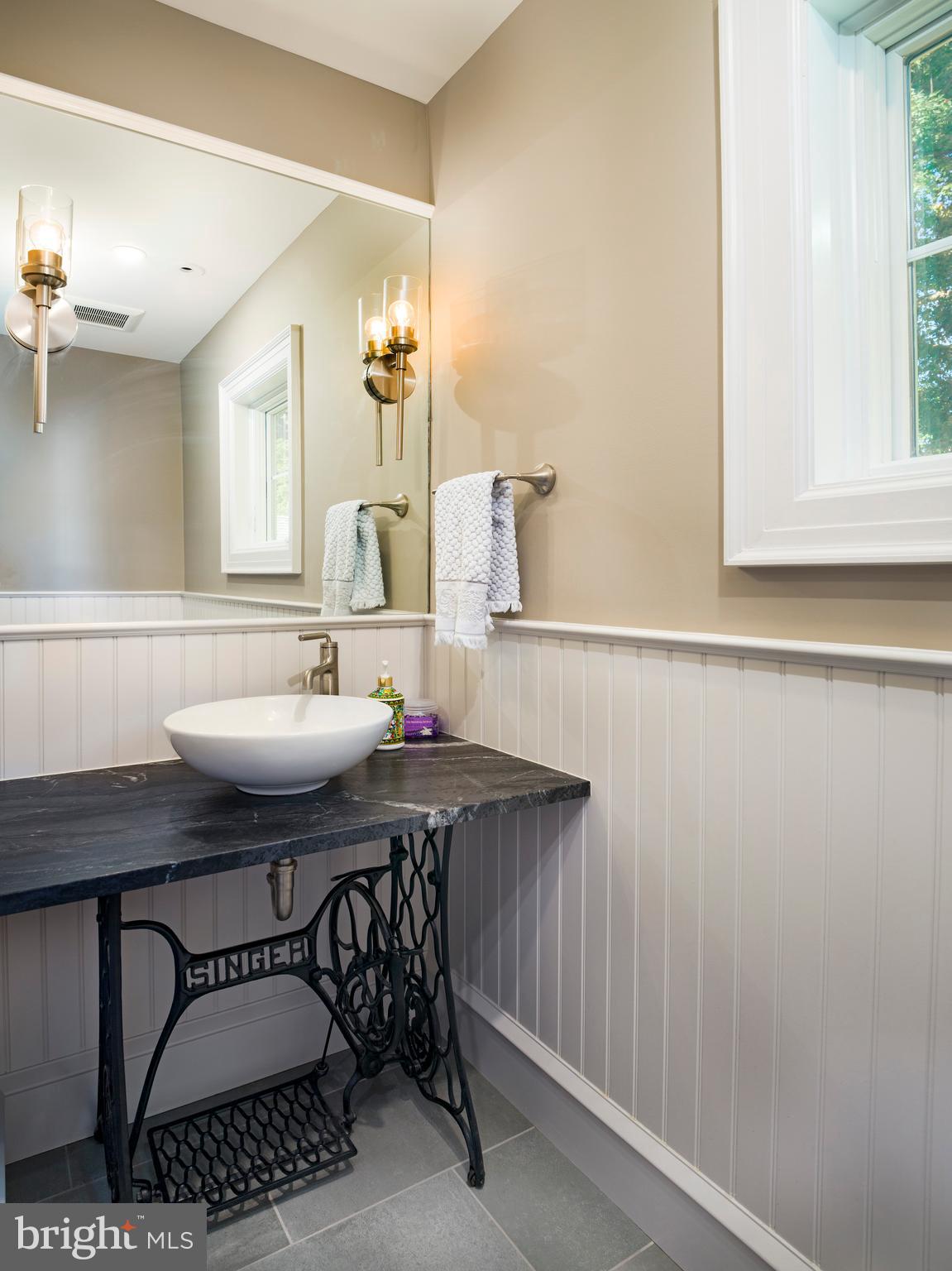 11 Shirley Road Narberth, PA 19072 - Photo 23 of 44 a bathroom with a sink a mirror and a window