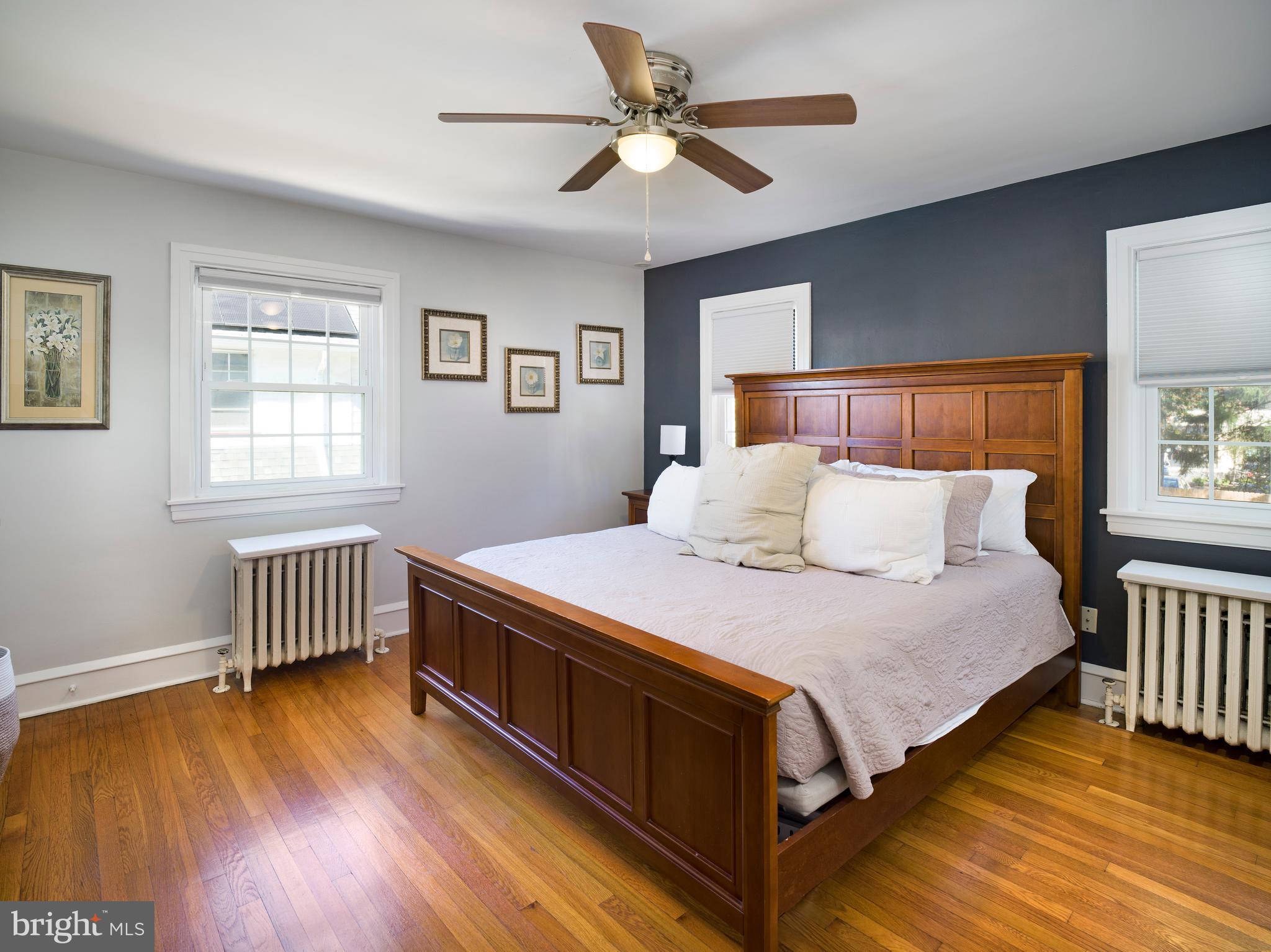 11 Shirley Road Narberth, PA 19072 - Photo 26 of 44 a bedroom with a bed and a chandelier