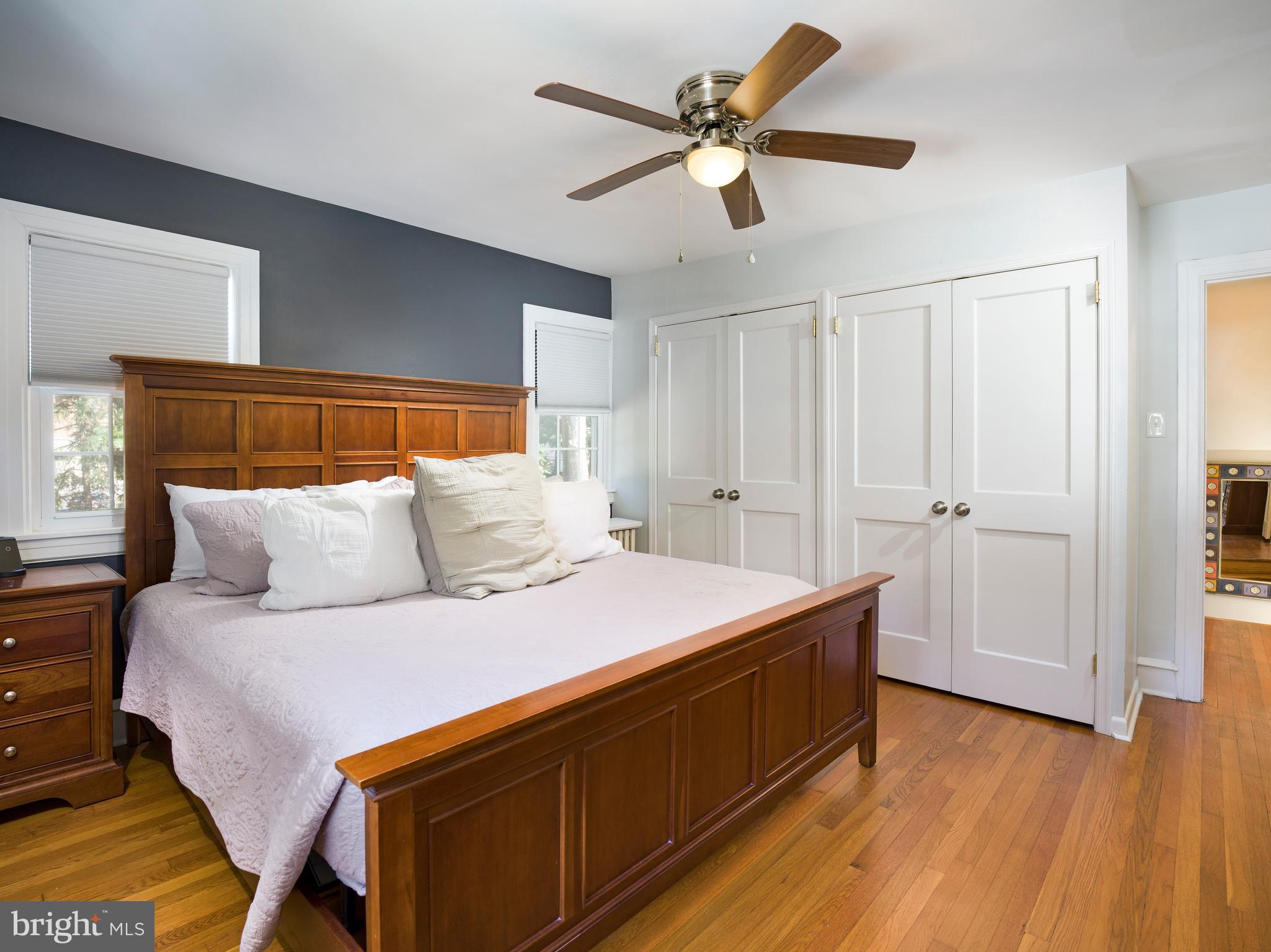 11 Shirley Road Narberth, PA 19072 - Photo 27 of 44 a spacious bedroom with a bed and a chandelier