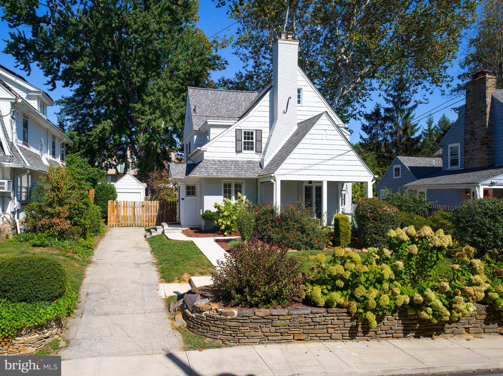 11 Shirley Road Narberth, PA 19072 - Photo 3 of 44 a front view of a house with a garden