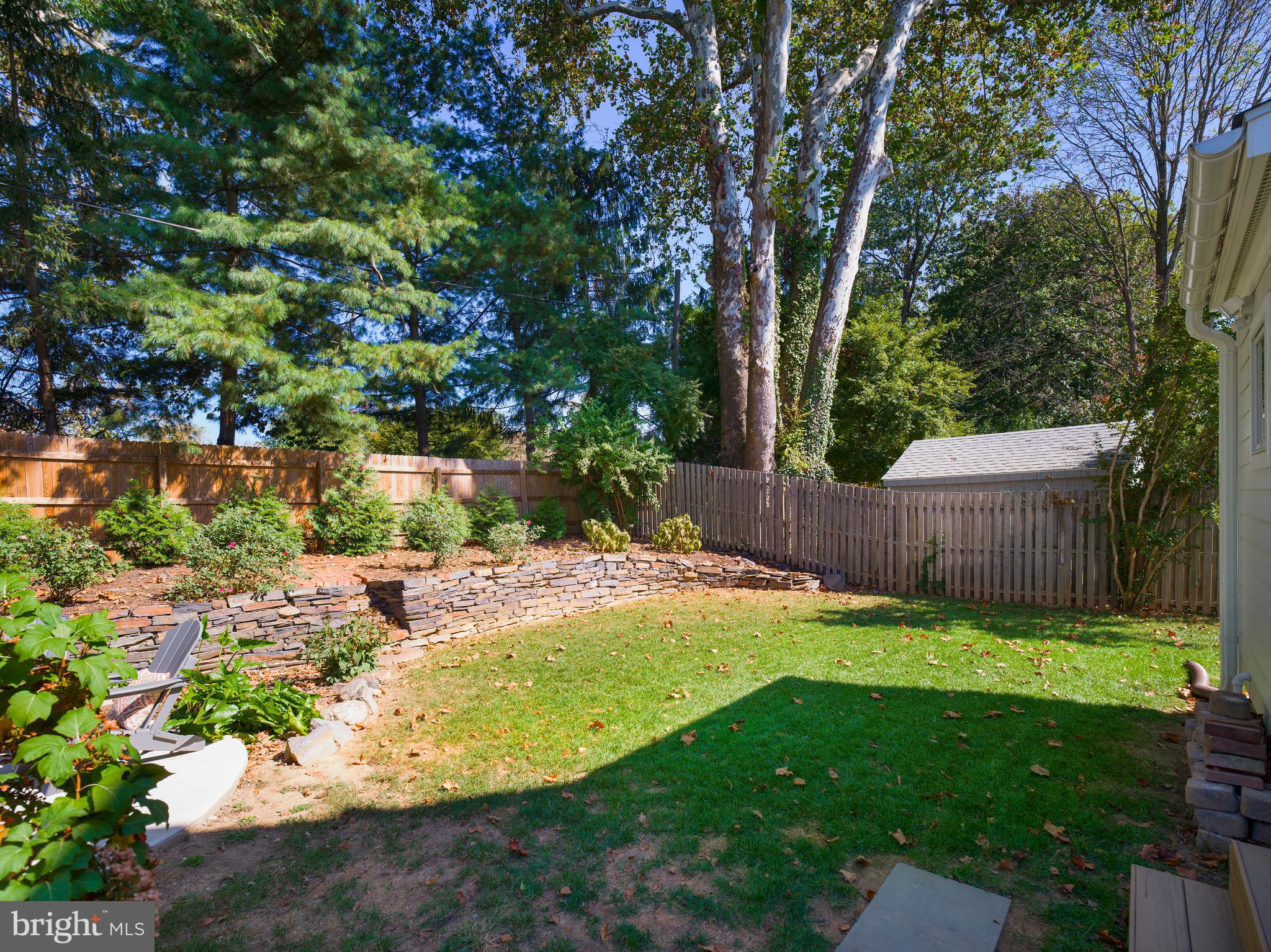 11 Shirley Road Narberth, PA 19072 - Photo 36 of 44 a view of a backyard with large trees and plants
