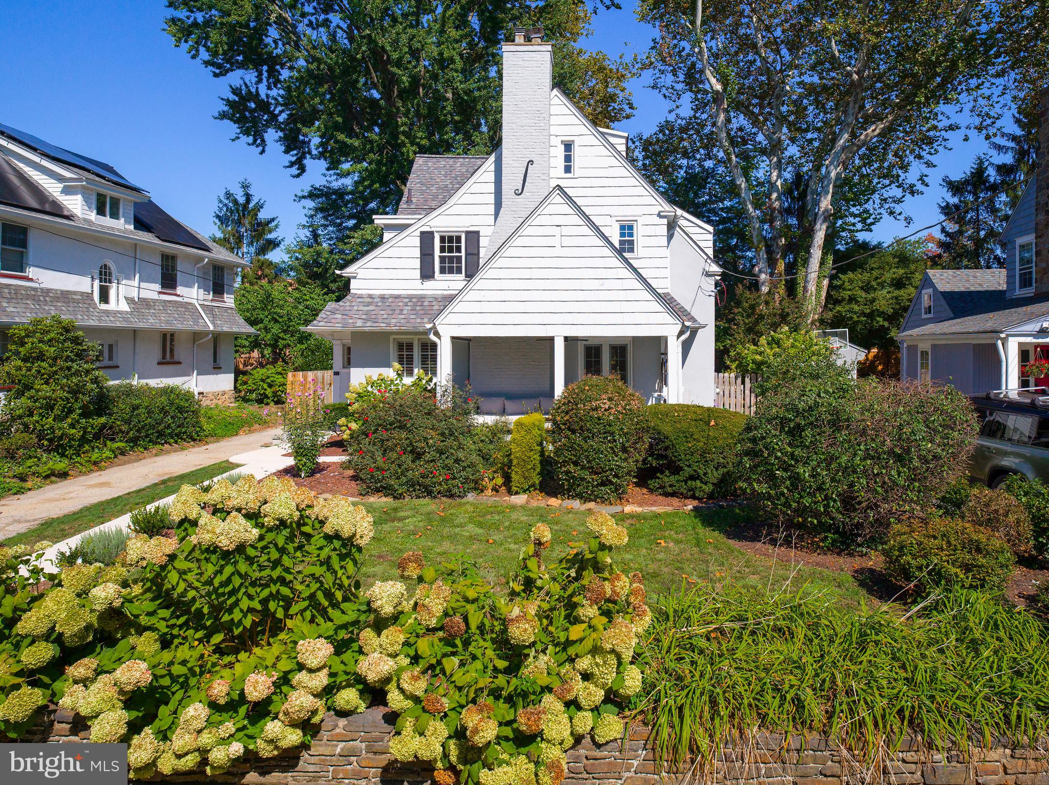 11 Shirley Road Narberth, PA 19072 - Photo 4 of 44 a front view of a house with a yard and fountain