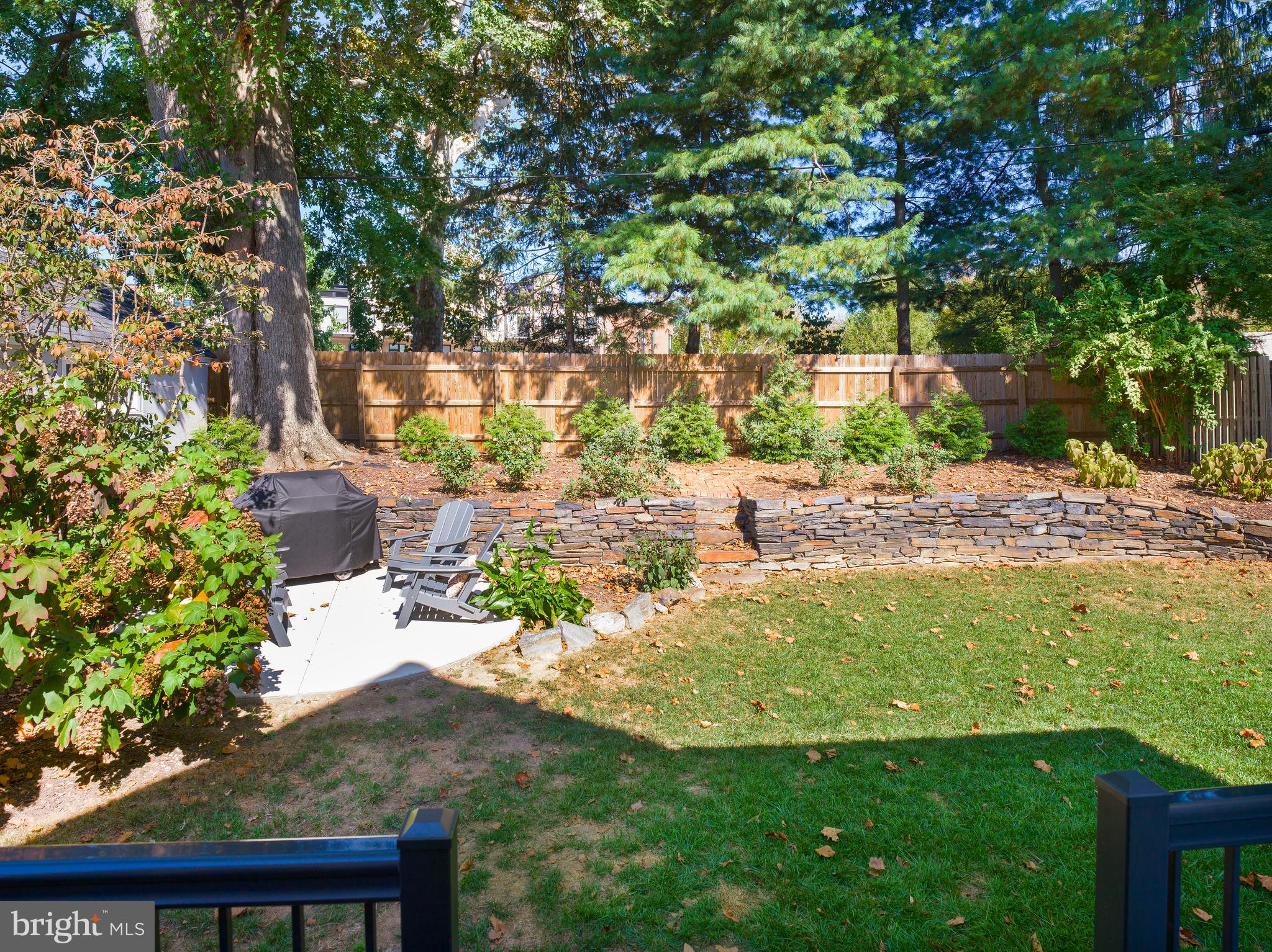 11 Shirley Road Narberth, PA 19072 - Photo 41 of 44 a backyard of a house with table and chairs