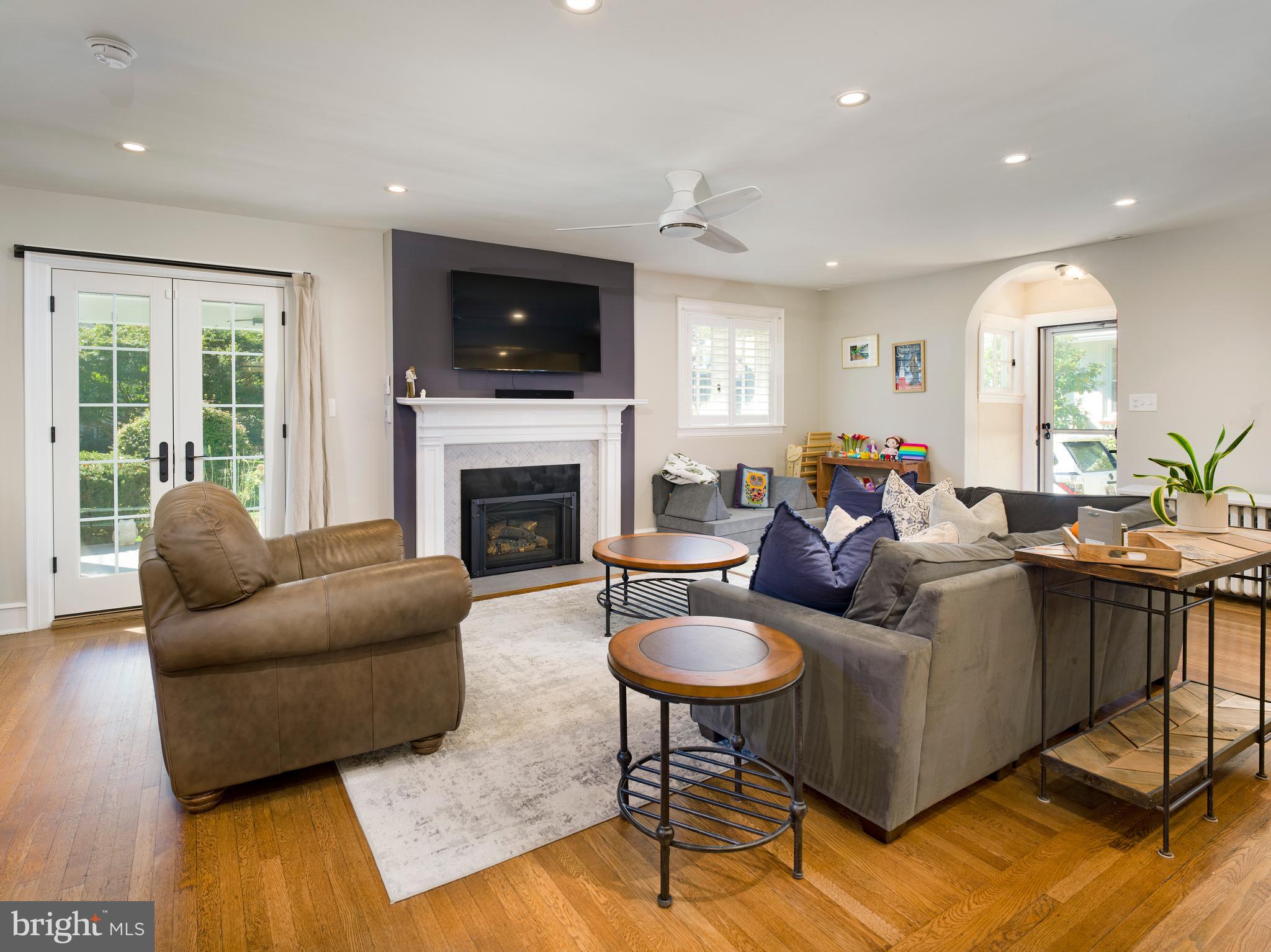 11 Shirley Road Narberth, PA 19072 - Photo 10 of 44 a living room with furniture fireplace and a flat screen tv