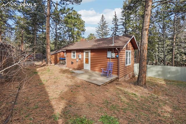 9025 Picabo Road Cascade, CO 80809 - Photo 24 of 43 Walk out deck off primary with fenced yard
