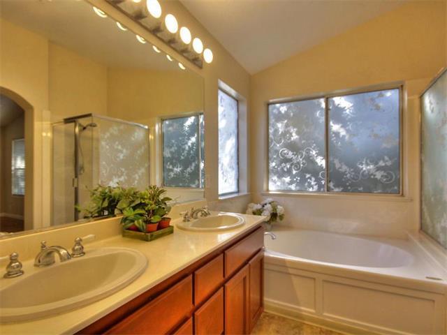 1806 Wayne Circle San Jose, CA 95131 - Photo 12 of 21 a bathroom with a tub a sink and mirror