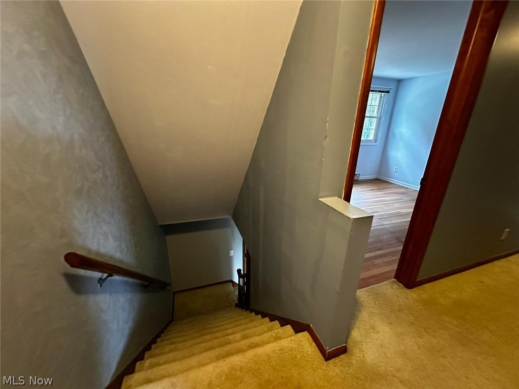 2093 Cambridge Road Coshocton, OH 43812 - Photo 20 of 32 Stairway featuring light hardwood / wood-style floors