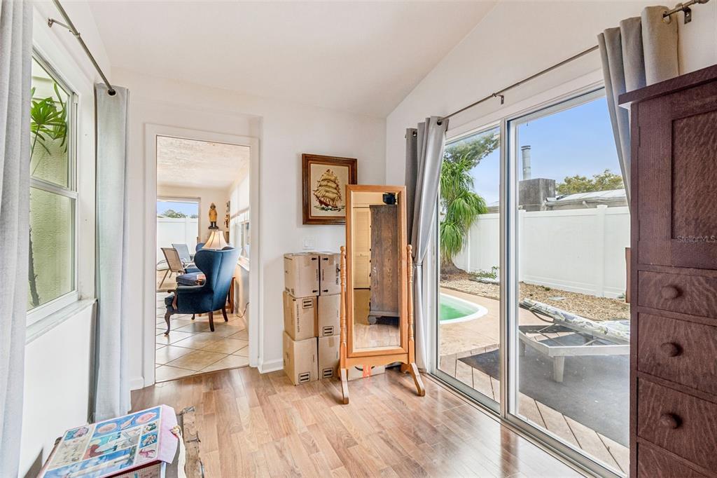 7740 Hawthorn Drive Port Richey, FL 34668 - Photo 12 of 27 a view of a livingroom with wooden floor and furniture