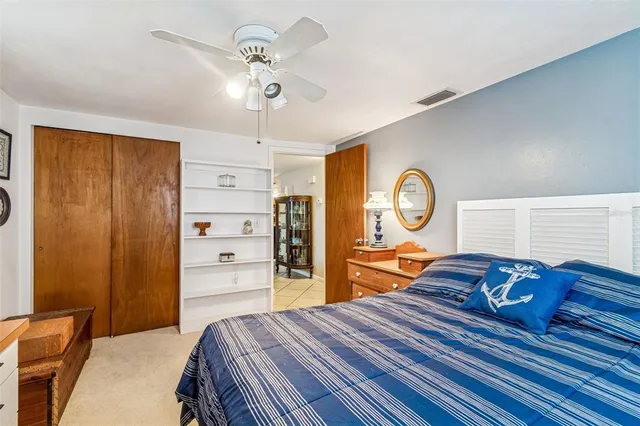 a bed room with a bed and a dresser