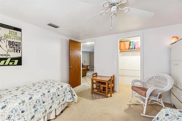 a bedroom with furniture and a bed