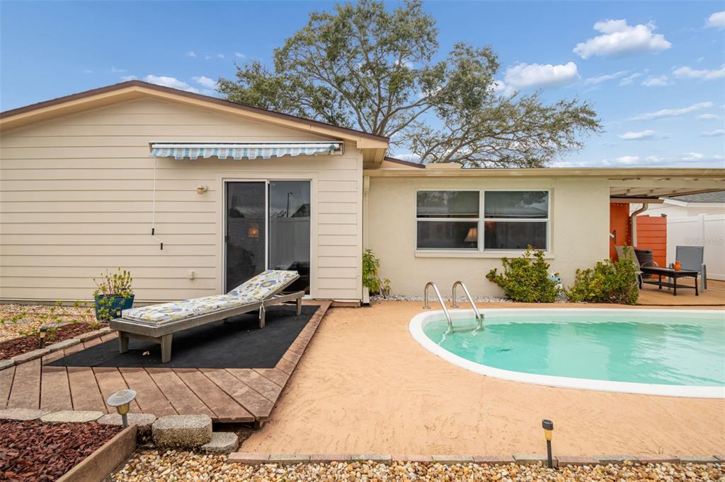 7740 Hawthorn Drive Port Richey, FL 34668 - Photo 27 of 27 a view of a house with backyard and sitting area