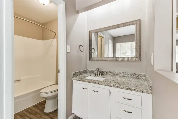 a bathroom with a white bath tub