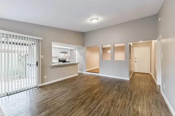 a view of a kitchen with wooden floor