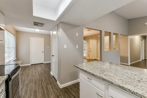 a kitchen with cabinets and appliances