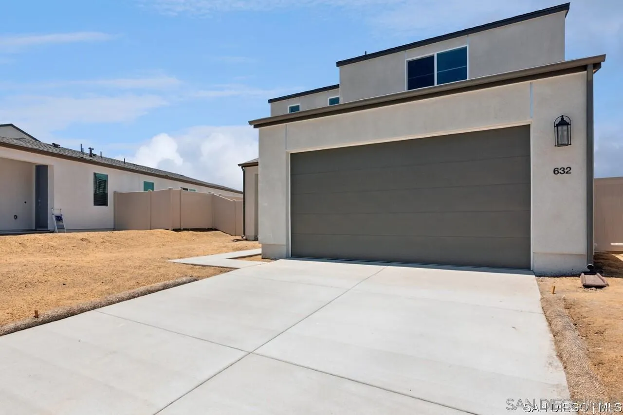 632 Meadowood Street Fallbrook, CA 92028 - Photo 20 of 21 a front view of a house with a garage