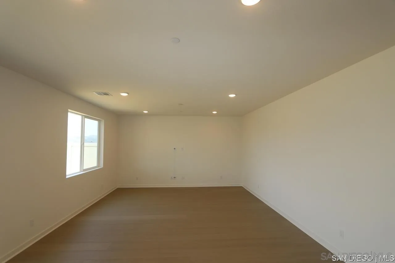 632 Meadowood Street Fallbrook, CA 92028 - Photo 2 of 21 an empty room with windows