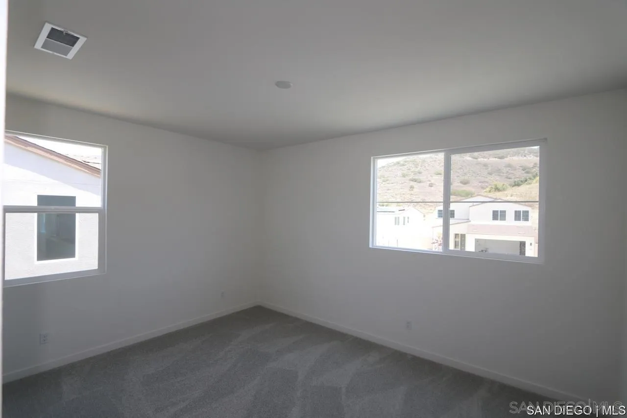 632 Meadowood Street Fallbrook, CA 92028 - Photo 4 of 21 an empty room with a window