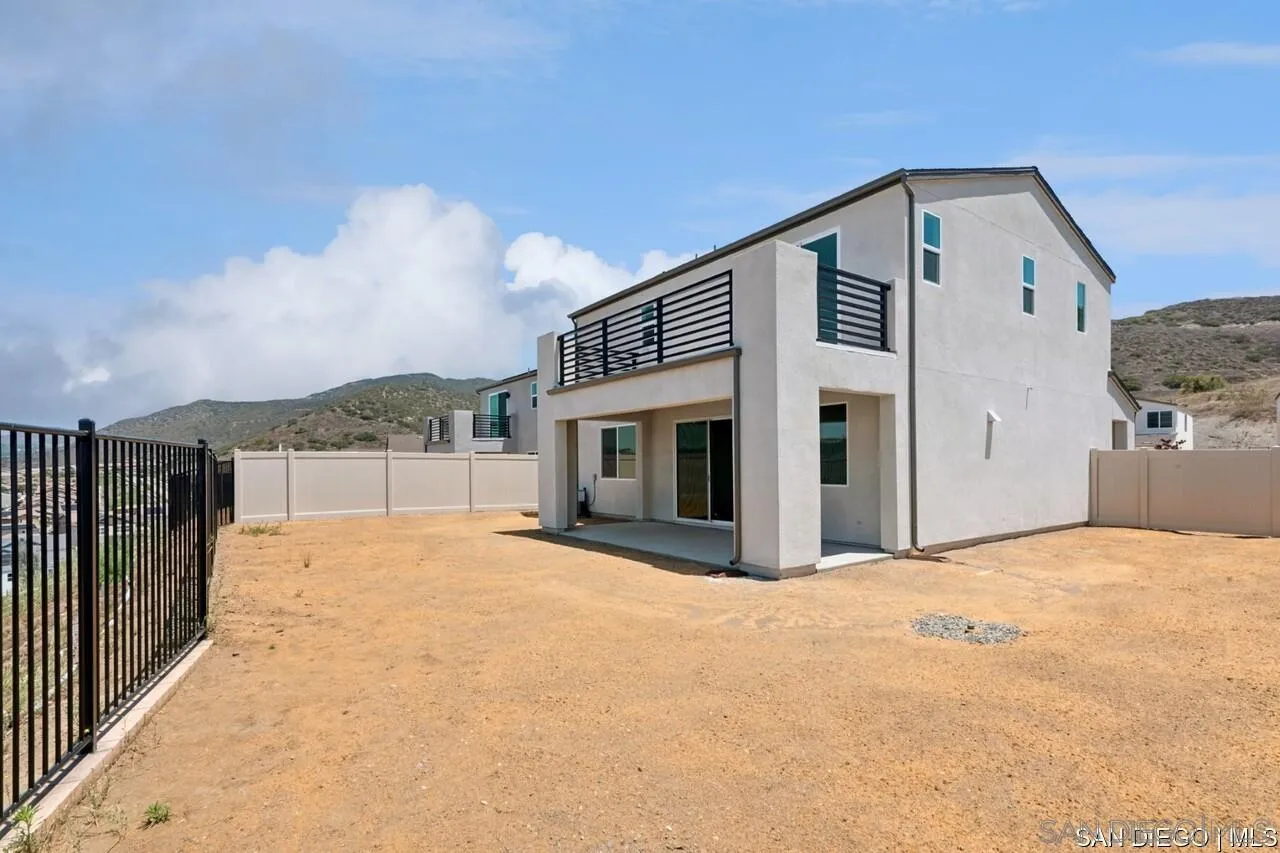 632 Meadowood Street Fallbrook, CA 92028 - Photo 10 of 21 a front view of a house with a yard