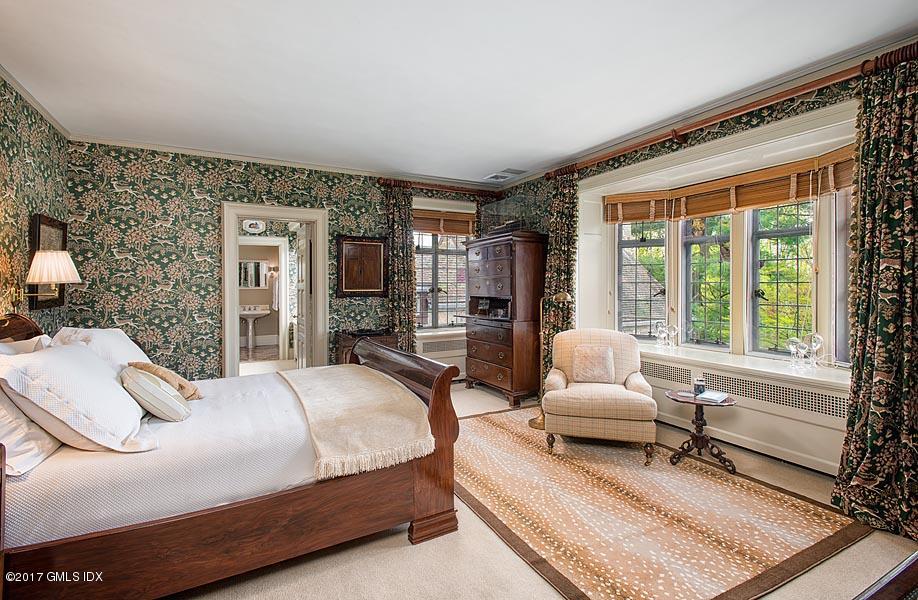 10 Flagler Drive Greenwich, CT 06830 - Photo 12 of 21 a bedroom with a bed wooden floor and lamp