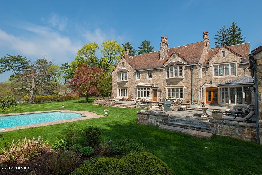 10 Flagler Drive Greenwich, CT 06830 - Photo 18 of 21 a view of house with garden space and swimming pool