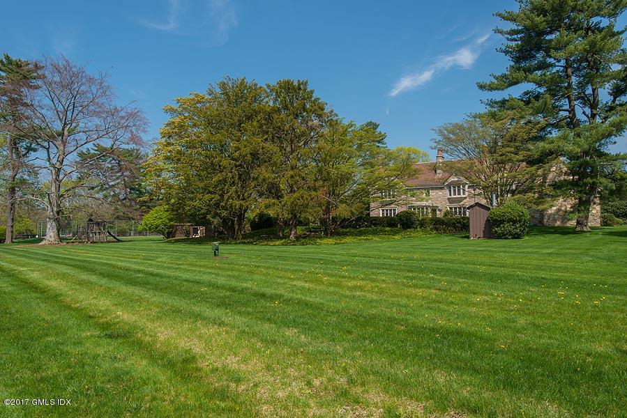 10 Flagler Drive Greenwich, CT 06830 - Photo 20 of 21 a view of a grassy field with trees