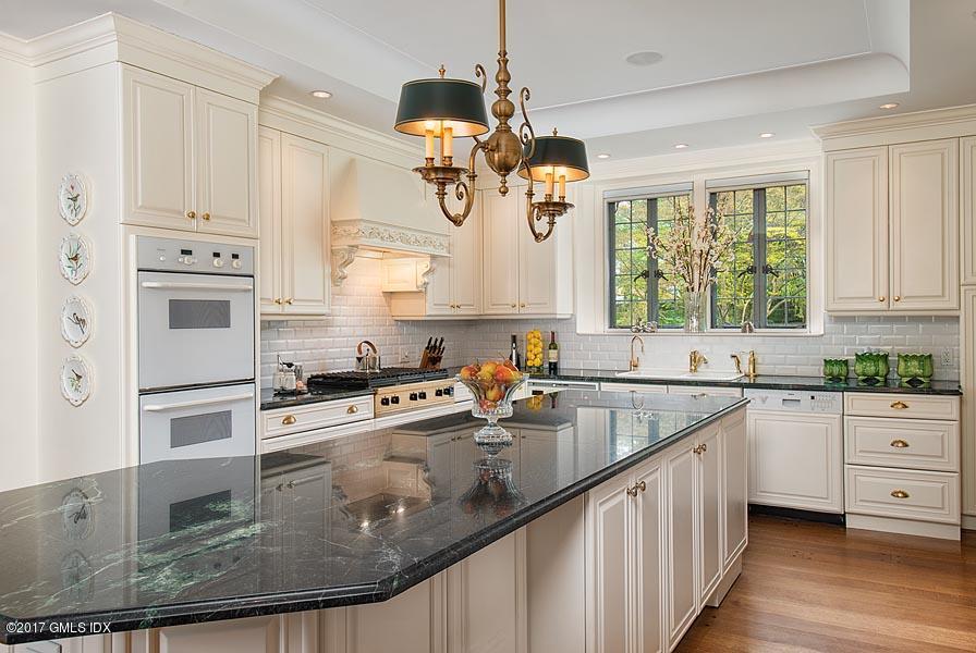 10 Flagler Drive Greenwich, CT 06830 - Photo 7 of 21 a kitchen with stainless steel appliances granite countertop a sink a stove and refrigerator