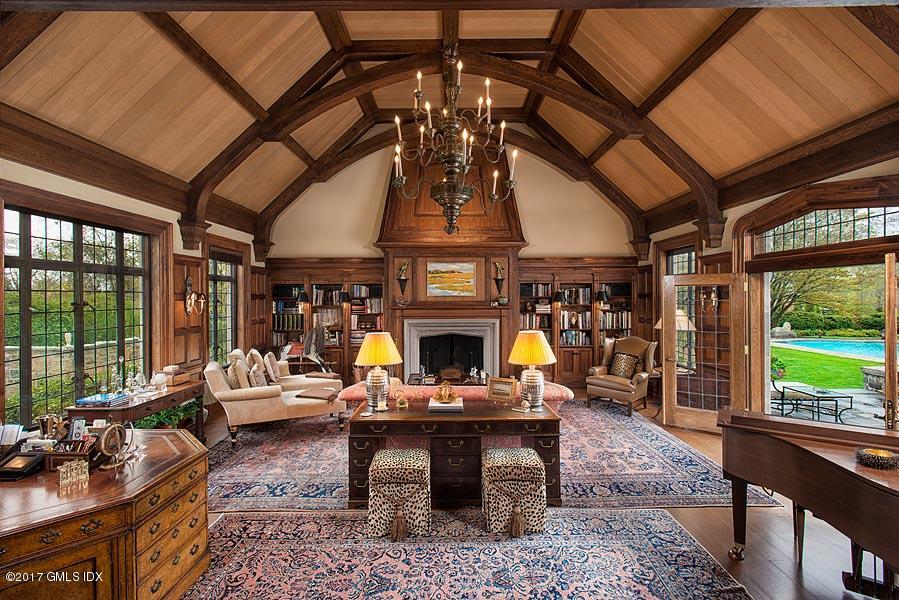 10 Flagler Drive Greenwich, CT 06830 - Photo 9 of 21 a living room with patio furniture and a fireplace