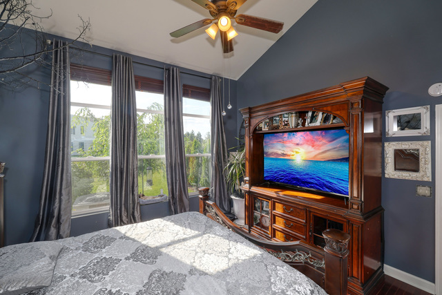 4579 Half Moon Drive, Unit D Yorkville, IL 60560 - Photo 15 of 44 a living room with flat screen tv and a floor to ceiling window