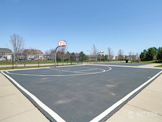 4579 Half Moon Drive, Unit D Yorkville, IL 60560 - Photo 29 of 44 a view of a tennis court