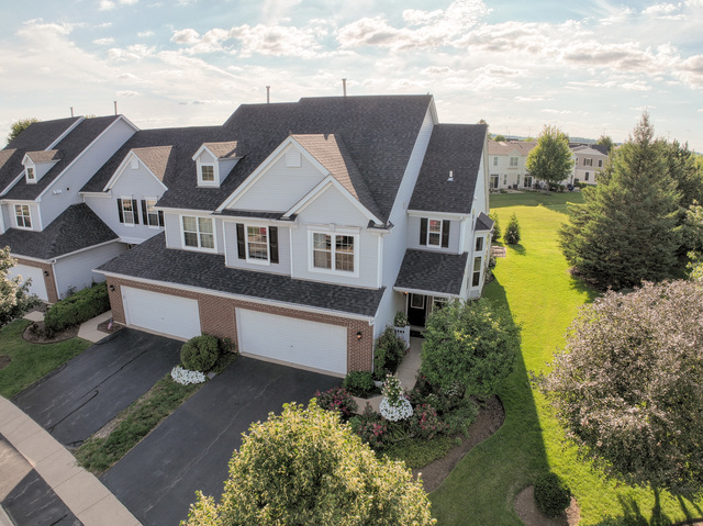 4579 Half Moon Drive, Unit D Yorkville, IL 60560 - Photo 3 of 44 a aerial view of a house with swimming pool and a yard