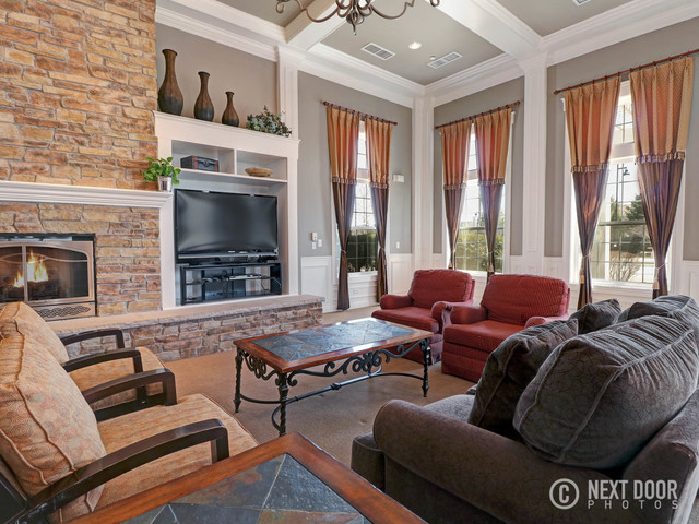 4579 Half Moon Drive, Unit D Yorkville, IL 60560 - Photo 36 of 44 a living room with furniture fireplace and flat screen tv