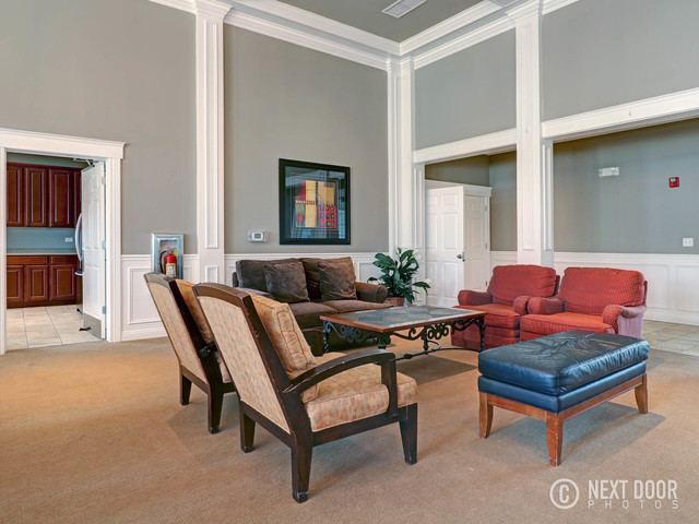 4579 Half Moon Drive, Unit D Yorkville, IL 60560 - Photo 37 of 44 a living room with furniture and a wooden floor