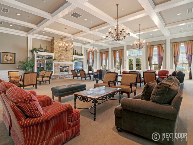 4579 Half Moon Drive, Unit D Yorkville, IL 60560 - Photo 40 of 44 a living room with furniture kitchen view and large windows