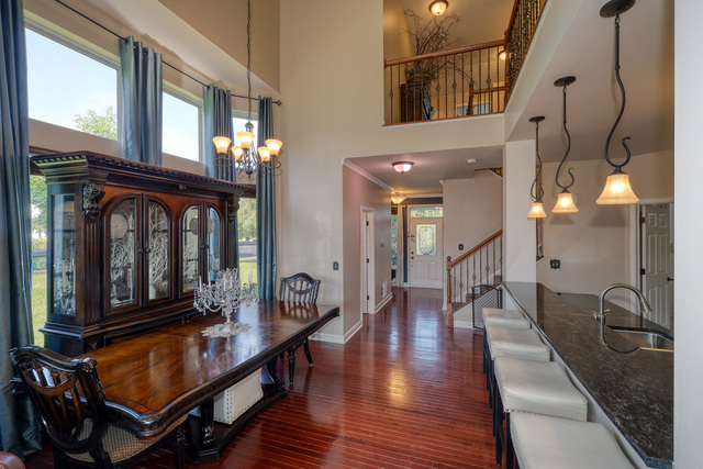 4579 Half Moon Drive, Unit D Yorkville, IL 60560 - Photo 6 of 44 a lobby with furniture and wooden floor