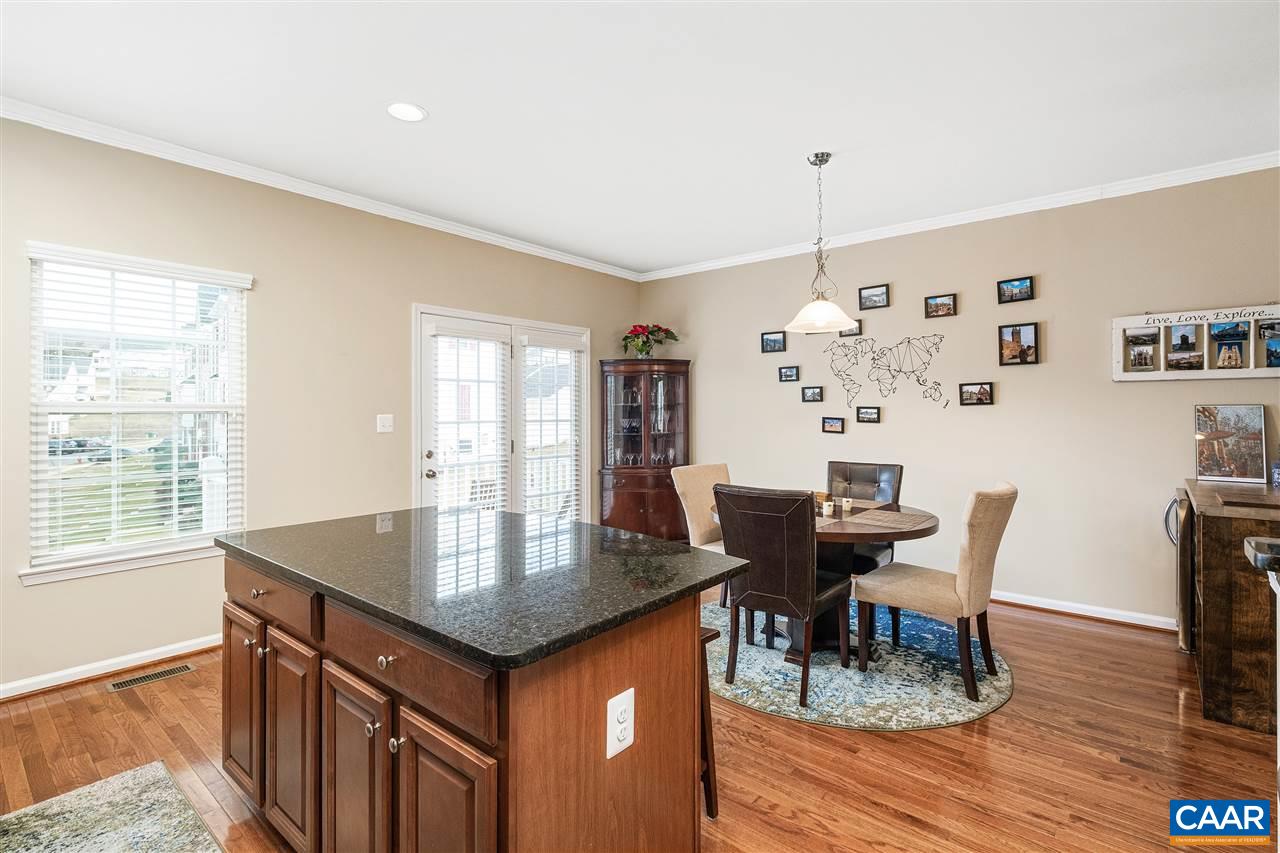 462 Rolkin Road Charlottesville, VA 22911 - Photo 10 of 30 a view of a dining room with furniture window and wooden floor
