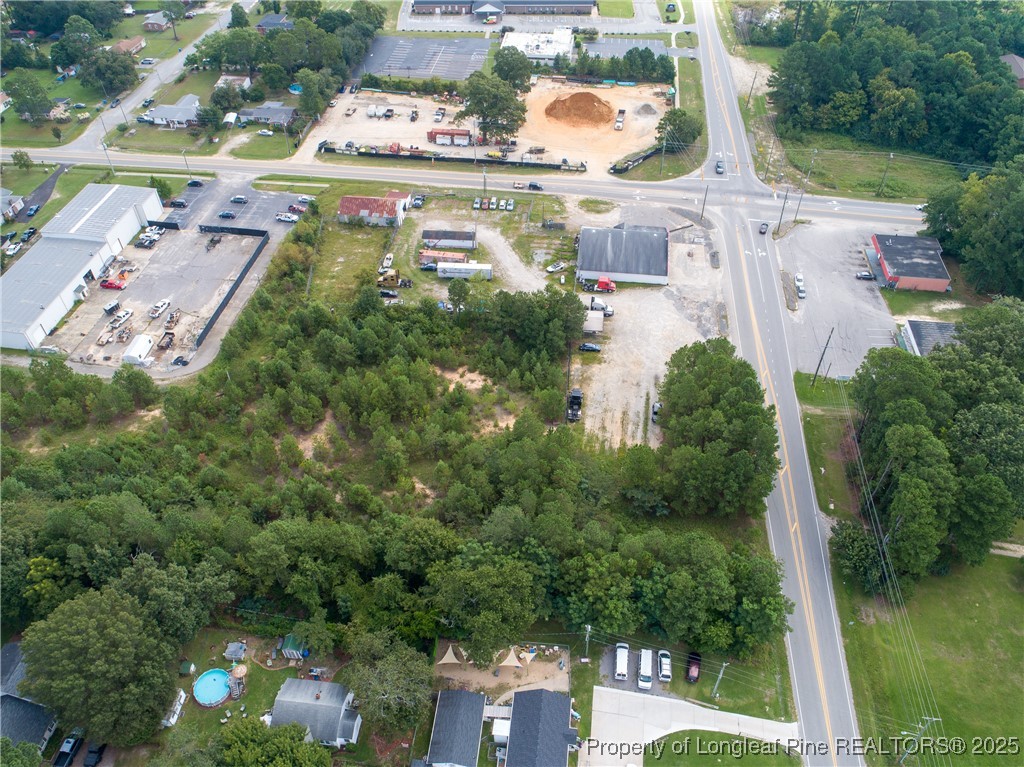 7604 Raeford Road Fayetteville, NC 28314 - Photo 16 of 20 an aerial view of residential houses with outdoor space and street view
