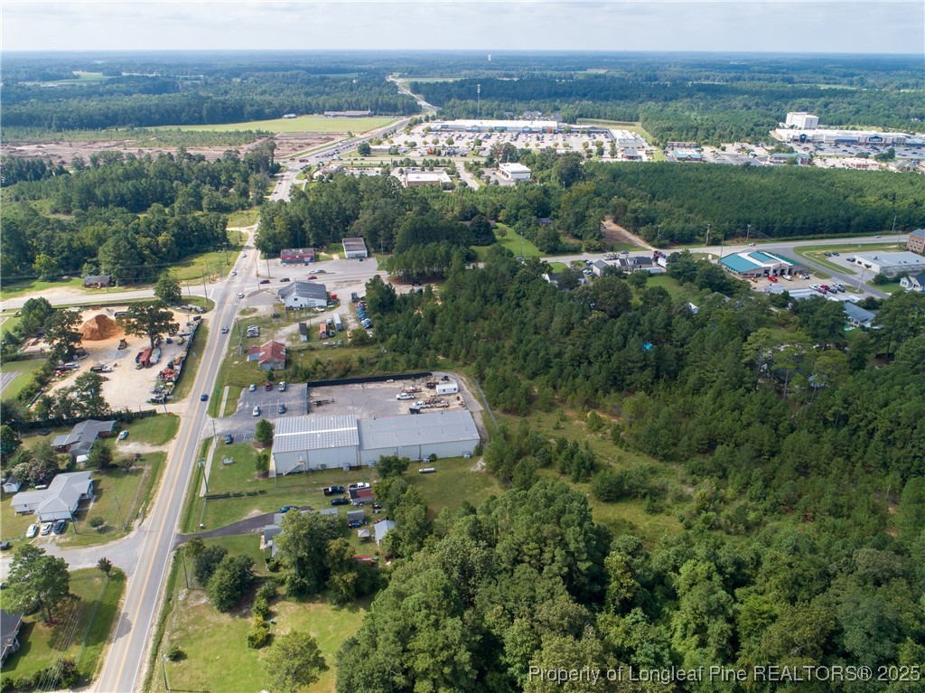 7604 Raeford Road Fayetteville, NC 28314 - Photo 6 of 20 an aerial view of a city with lots of residential buildings ocean and mountain view