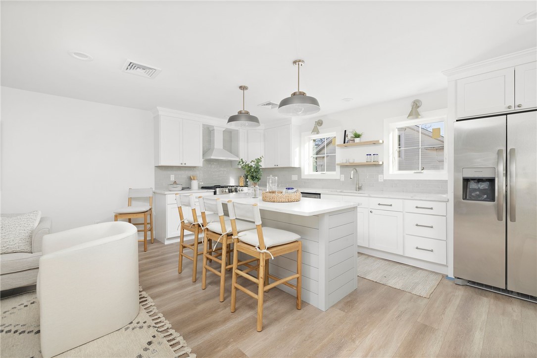 17 Nobert Street, Unit 2 Warren, RI 02885 - Photo 4 of 38 Photo is of the end unit 17 Nobert Unit 1. Same finishes. White tile backsplash instead of grey. Different styled hardware.