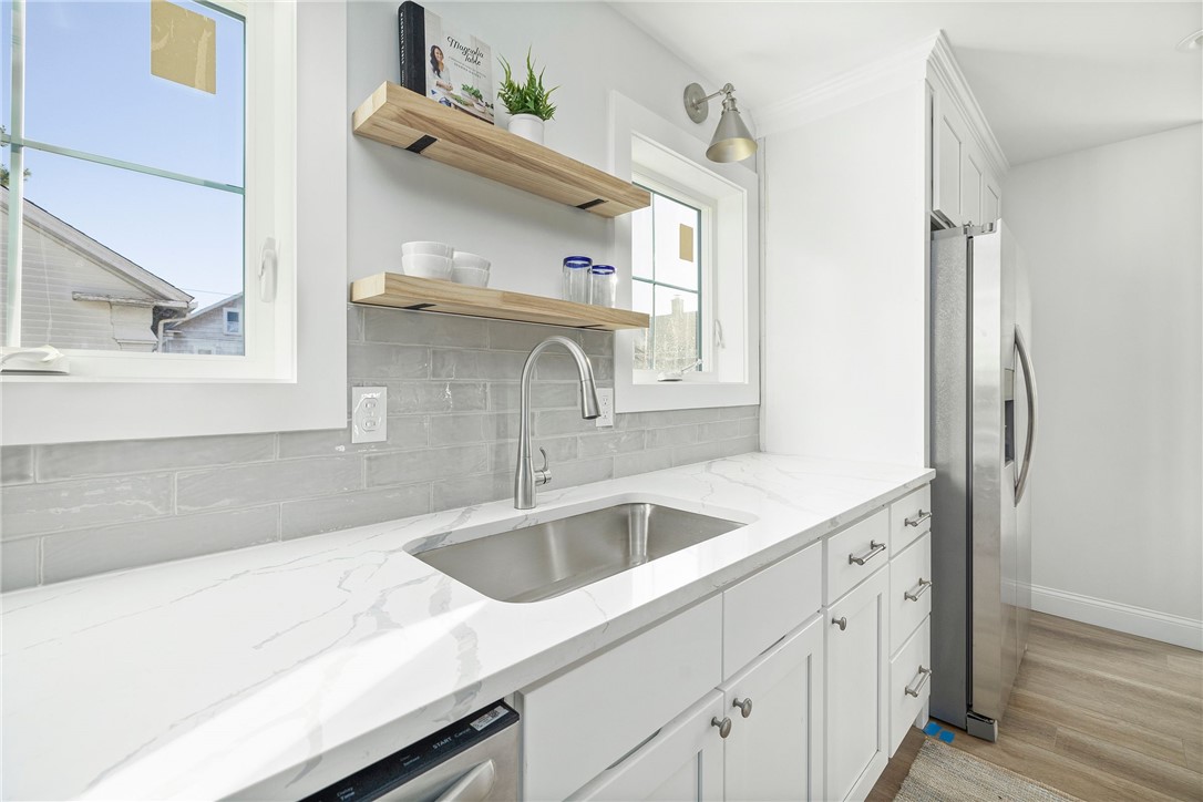 17 Nobert Street, Unit 2 Warren, RI 02885 - Photo 5 of 38 Photo is of the end unit 17 Nobert Unit 1. Same finishes. White tile backsplash instead of grey. Different styled hardware.