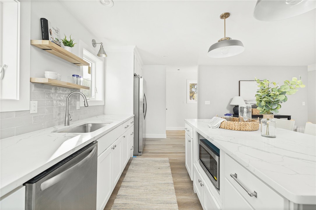 17 Nobert Street, Unit 2 Warren, RI 02885 - Photo 6 of 38 Photo is of the end unit 17 Nobert Unit 1. Same finishes. White tile backsplash instead of grey. Different styled hardware.