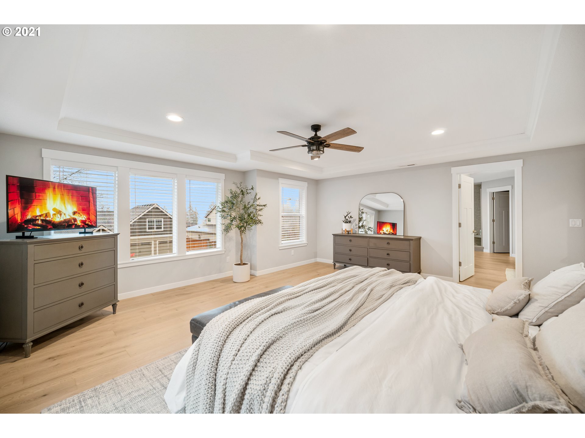 16215 Jada Way Oregon City, OR 97045 - Photo 23 of 32 a spacious bedroom with a bed and a flat screen tv
