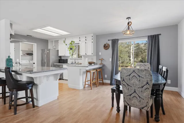 a view of a dining room with furniture window and outside view