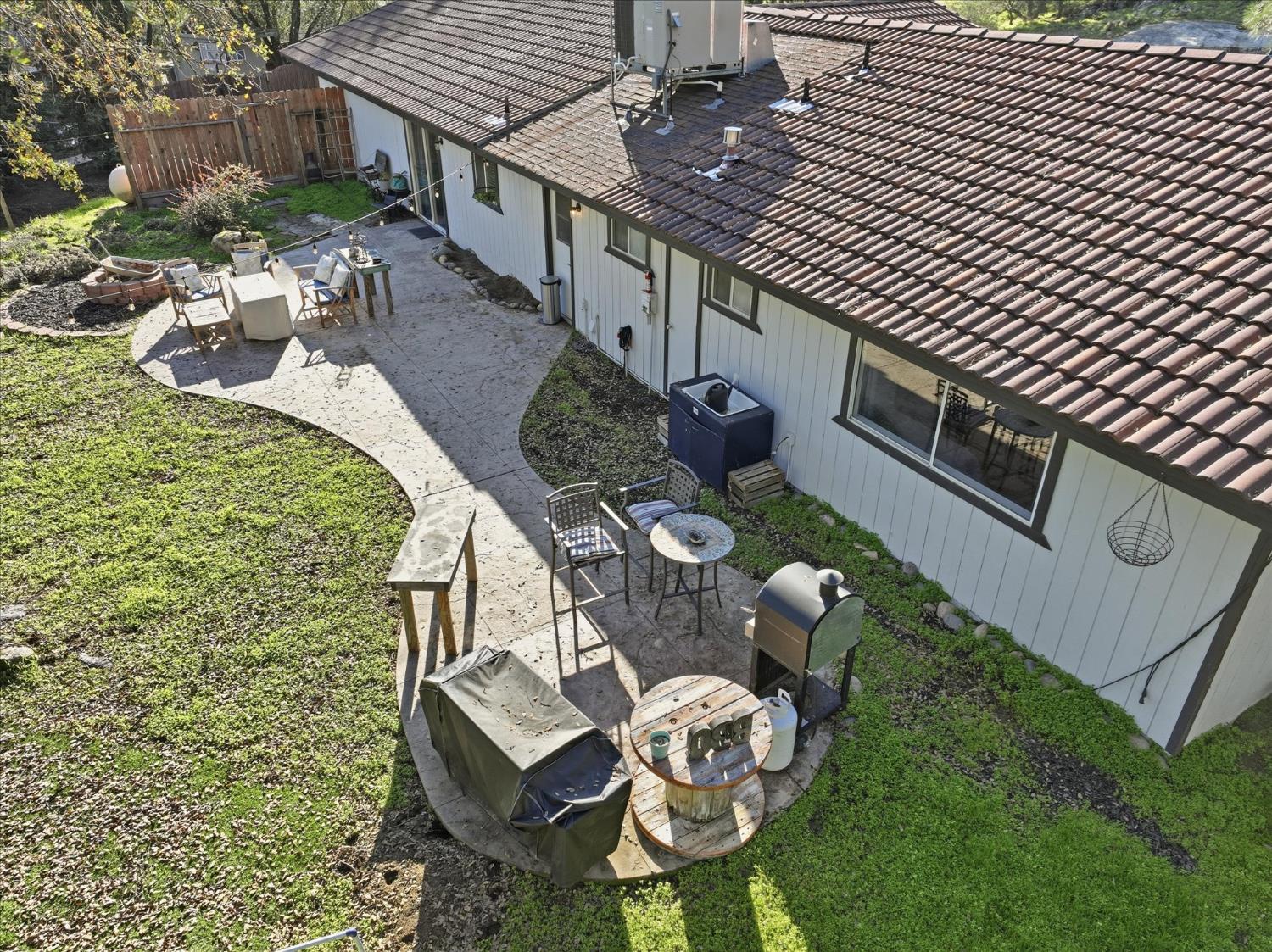 31083 Moccassin Court Coarsegold, CA 93614 - Photo 32 of 42 a backyard of a house with seating space